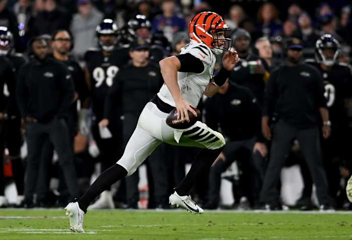 Jake Browning scrambles in Thursday Night Football at Baltimore.